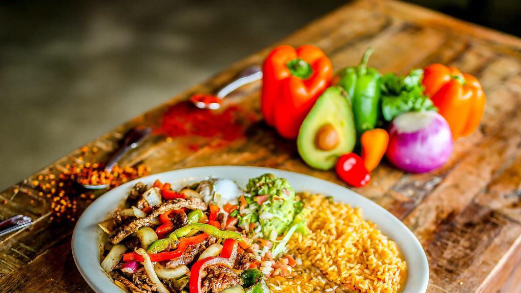 Fajitas Chiquitas · Gluten-free.  A new twist! Your choice of grilled steak or chicken with sliced red and white onions and mixed bell peppers. Served with Mexican rice, refried beans, shredded cabbage, sour cream, guacamole, and pico de gallo.