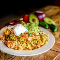 Nachos · Gluten-free. Refried beans, mixed shredded cheese, lettuce, sliced pickled jalapeño peppers,...