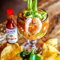 Coctel De Camarón · Gluten-free. Mexican style shrimp cocktail made with clamato juice, ketchup, chopped tomatoe...