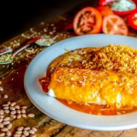 Burrito Al Pastor · Flour tortilla filled with marinated diced pork, Mexican rice, charro beans, pico de gallo, ...