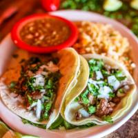 Grilled Steak Tacos · Gluten-free. Three traditional soft corn tortillas filled with tender chargrilled steak, cil...