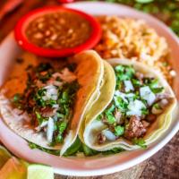 Grilled Chicken Tacos · Gluten-free. Three street tacos simple yet tasty. Two soft corn tortillas filled with grille...