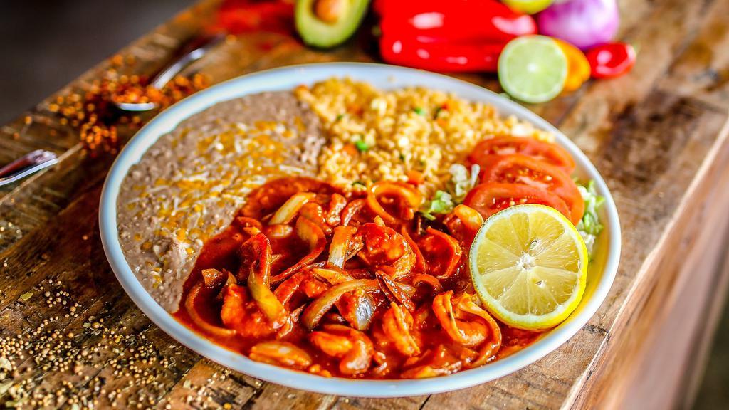 Camarones A La Diabla · Gluten-free. Shrimp sautéed in onions, our blend of spices and hot sauce. Served with Mexican rice and refried beans.