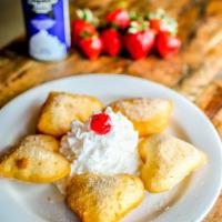 Sopapillas · Lightly fried pastries sweetened with sugar and cinnamon. Served with whipped cream, honey, ...