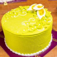 Pandan Coconut Cake (8 In) · Pandan flavored sponge cake filled with a layer of young coconut strips. Outside decorated w...