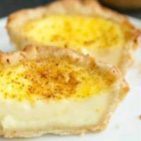 Egg Custard Tart · A small egg pastry served either chilled or warmed. Light buttery and flaky crust filled wit...