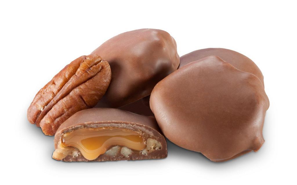Milk Chocolate Caramel Pecan Turtles · Treat yourself to fresh pecans smothered in gooey caramel and coated with milk chocolate. 14 piece box.