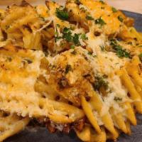 Garlic Parmesan Fries · Crispy waffle fries tossed with house-made garlic butter, sprinkled with parmesan and served...