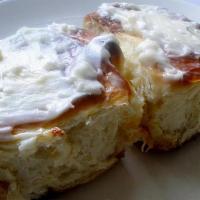Large Iced Cinnamon Roll · Large Cinnamon roll served with housemade butter cream icing  on the side
