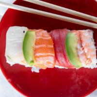 Rainbow Roll · Raw. Crab salad, cucumber inside, tuna, salmon and shrimp avocado on top.