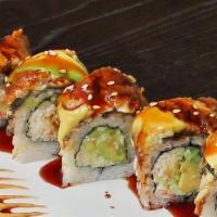 Dragon Roll · Inside: shrimp tempura and cucumbers. Top: avocado, eel.
