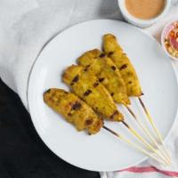 Chicken Satay · Marinated chicken grilled on skewers served with peanut sauce and cucumber vinaigrette dip.