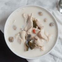 Tom Kha · Vegan. Gluten free. Rich and creamy coconut milk broth with chicken or tofu, mushrooms, lemo...