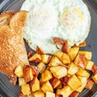 2 Eggs Served With Breakfast Potato & Toast · Two eggs to your liking potatoes and toast