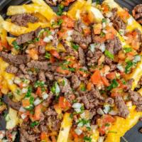 Asada French Fries · French fries and melted cheese topped with carne asada and pico de gallo.