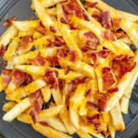 Bacon Cheese Fries · Tossed with bacon bits and melted cheese.