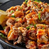Crispy Calamari.. · asian slaw, spicy aioli, sweet chili sauce