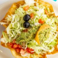 Taco Salad · Lettuce, tomato, guacamole and sour cream in crispy flour tortilla bowl. With your choice of...