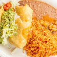 Chimichanga · Beef or chicken with rice, beans, chile verde, guacamole and sour cream.