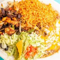 Beef Or Chicken Fajitas · Served with beans, rice, avocado, and flour or corn tortillas.