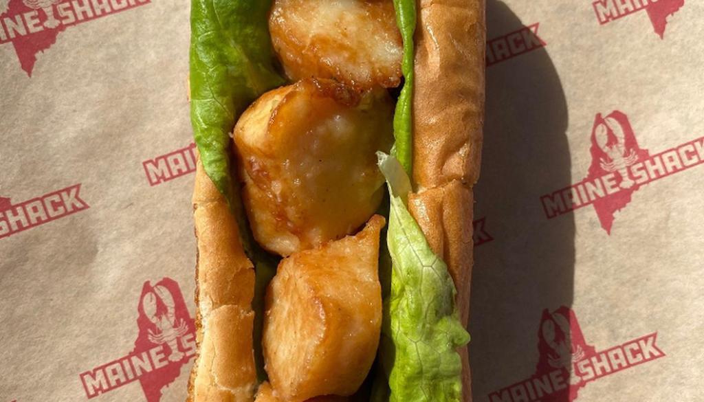 Scallop Roll · *Based on Market Price* Fried Scallops, Bibb Lettuce, & Tartar Sauce on New England Style Bun. Served with Chips.