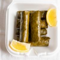 Dolma (6) · Our homemade grape leaves with a seasoned rice mixture