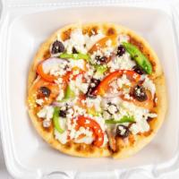Pita Pizza · Our Delicious Greek Pizza which is a Pita Bread topped with our Pizza Sauce, Mozzarella Chee...