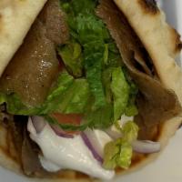 Classic Gyro · Comes with Lettuce, Tomato and Onion and topped with our Tzatziki Sauce wrapped in a Pita Br...