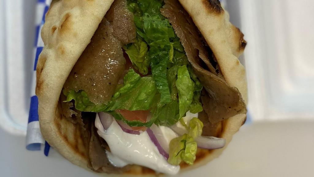 Classic Gyro · Comes with Lettuce, Tomato and Onion and topped with our Tzatziki Sauce wrapped in a Pita Bread