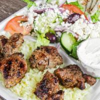 Lamb Souvlaki Plate · Comes with a choice of French Fries or Rice, Greek Salad, Small Side of Tzatziki and Pita Br...