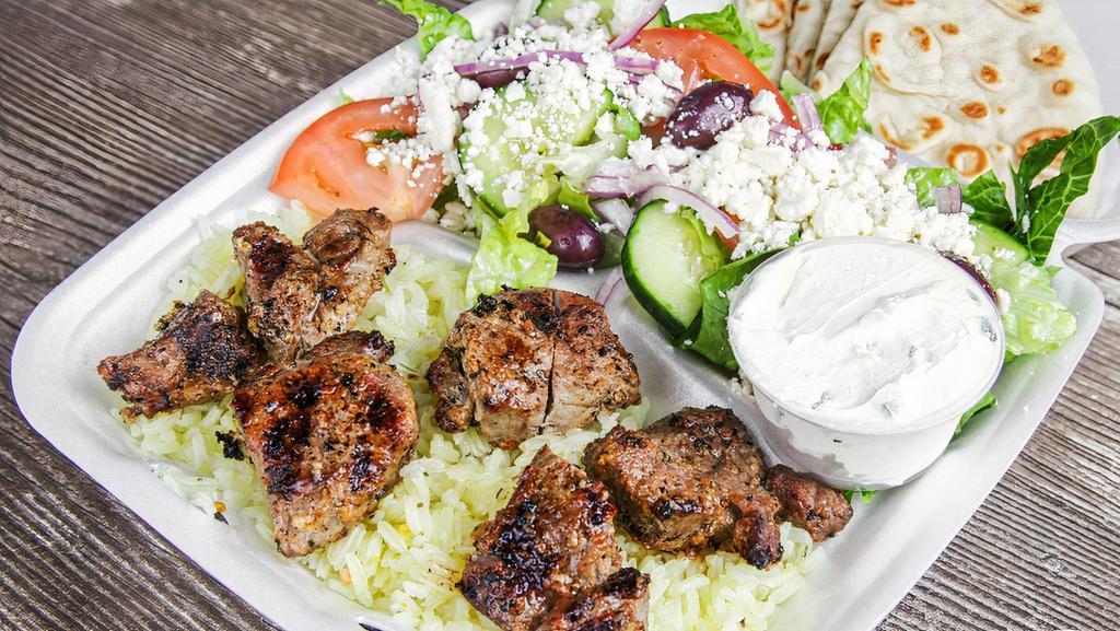 Lamb Souvlaki Plate · Comes with a choice of French Fries or Rice, Greek Salad, Small Side of Tzatziki and Pita Bread.