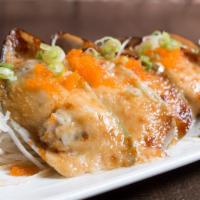 Baked Green Mussels · 5 pieces. Baked with yum yum sauce, masago and scallions on top.