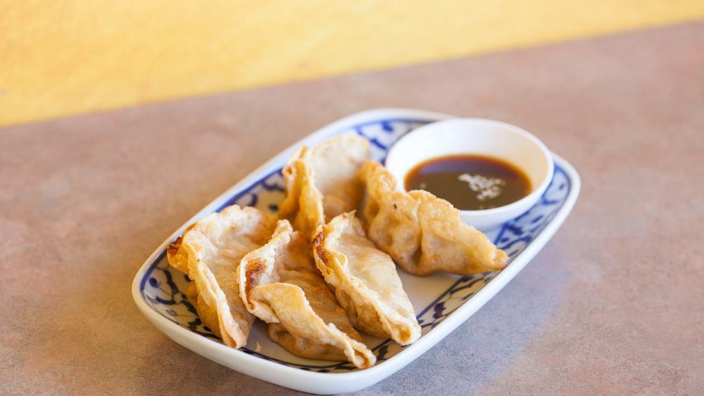 Potstickers · Fried chicken and vegetable dumpling. Served with sesame sauce.