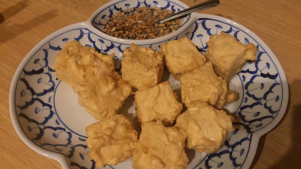 Fried Tofu · Crispy fried lightly battered tofu. Served with honey-vinegar sauce and ground peanuts.