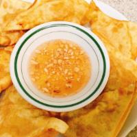Giew Tod · Seasoned ground chicken and shrimp wrapped in wonton skin, crispy fried until golden brown. ...