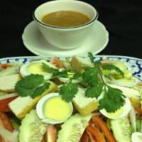 Thai Salad · Mixed vegetables topped with steamed fried tofu, slices of hard-boiled eggs, onion, carrot, ...