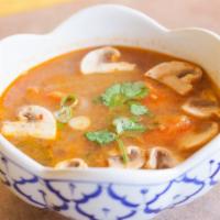 Tom Yum · Hot and sour soup with mushroom, tomatoes, onion, mixed with Tom Yum paste. Choice of chicke...