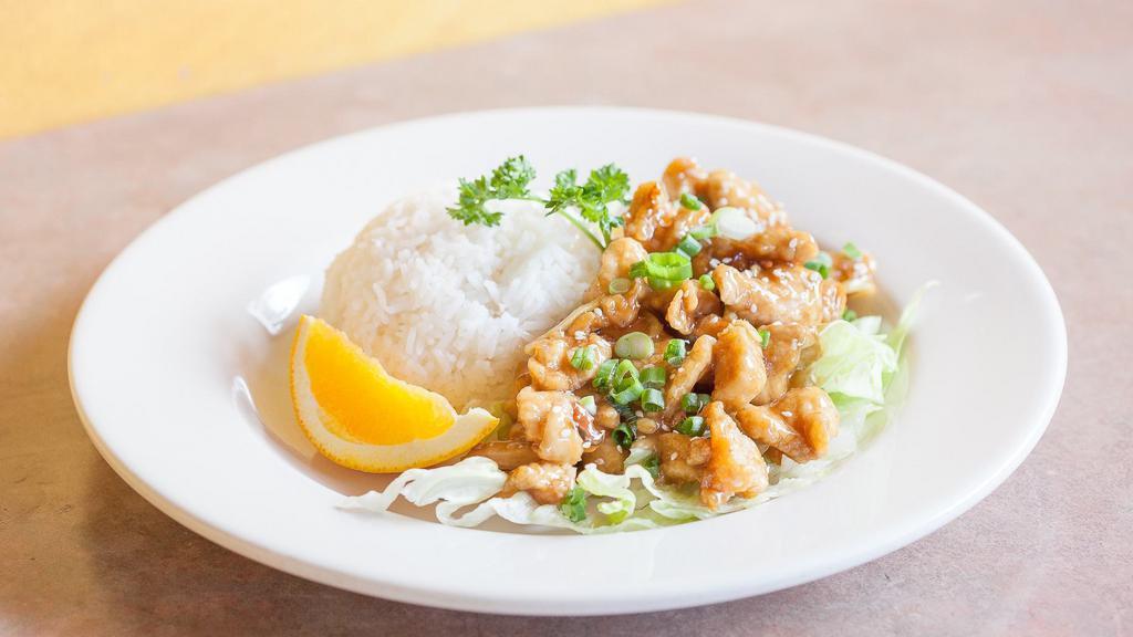 Orange Chicken · Slices of crispy fried chicken breast mixed with tangy and flavorful orange sauce, ginger, onion, and sesame seeds. Served steamed white rice.