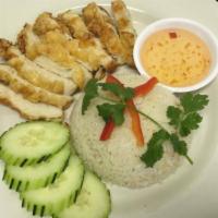 Khao Man Gai Thod (Famous Thai Street Food) · Steamed ginger garlic rice, served with slices of crispy fried chicken, and sweet and sour s...
