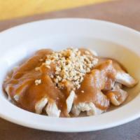 Chicken With Peanut Sauce · Steamed white meat chicken topped with warm peanut sauce and ground peanuts.