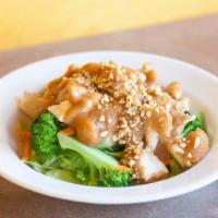 Swimming Angels · Steamed white meat chicken, broccoli, carrots, bok choy, cabbage, spinach topped with warm p...
