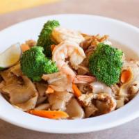Pad See Ew · Stir-fried wide-flat rice noodles with egg, broccoli and carrots with black soy sauce.