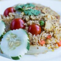 Simply Thai Fried Rice · Stir-fried white rice with tofu or meat, egg, onions, tomatoes, and mini mixed vegetables.