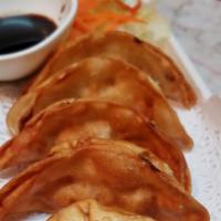  Potsticker · Deep fried potsticker filled with chicken and vegetable. Served with sweet sour sauce.