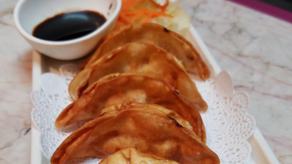  Potsticker · Deep fried potsticker filled with chicken and vegetable. Served with sweet sour sauce.