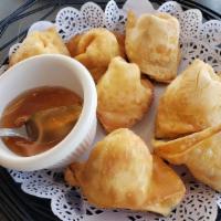  Crab Puffs · Crispy wonton skin stuffed with cream cheese, imitation crab,  and served with homemade swee...