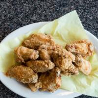 Chicken Wings · Spicy Eight pieces seasoned chicken wings deep fried in soybean oil.