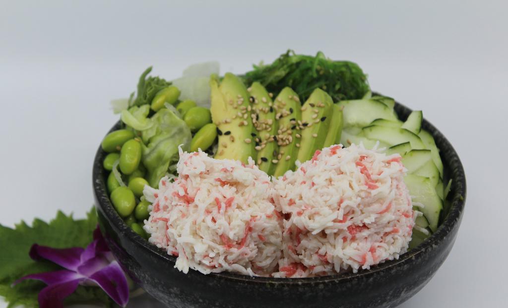 Snow Crab Poké Bowl · Choice of protein with rice base, pickled cucumber, avocado, edamame, green leaf lettuce and seaweed salad.
