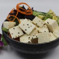 Tofu Poke Bowl · Choice of protein with rice base, pickled cucumber, avocado, edamame, green leaf lettuce and...