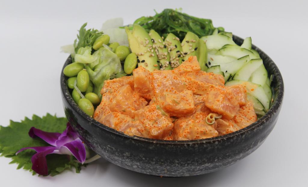 Spicy Salmon Salad Bowl · Choice of protein with salad base, pickled cucumber, avocado, carrot, red cabbage, edamame, sweet corn and seaweed salad. Contains raw fish.